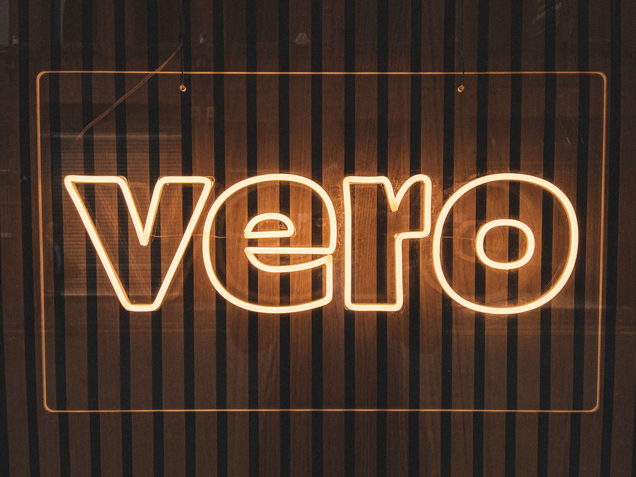 Vero in neon lights from the side window of a food bar
